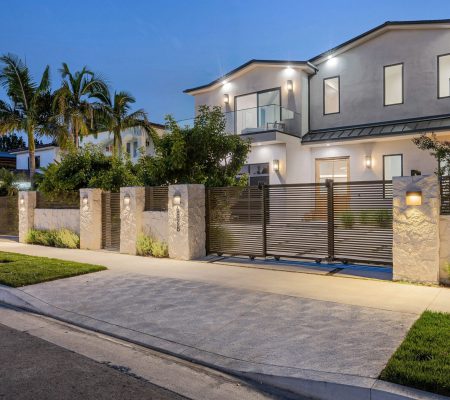 A,House,With,A,Beautiful,Garden,And,Metal,Gates.,California,